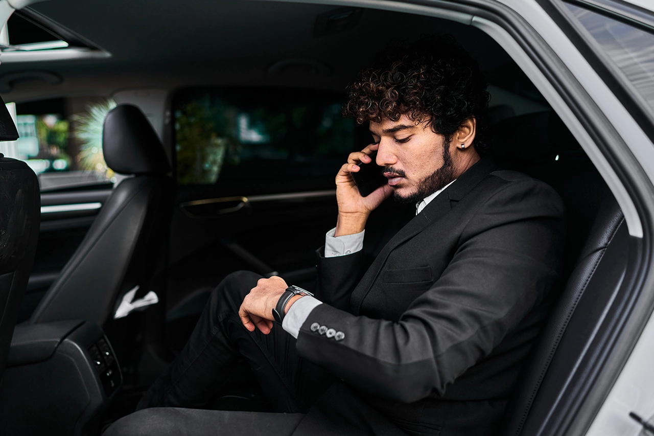 Businessman making a phone call in Newark Ride limo service